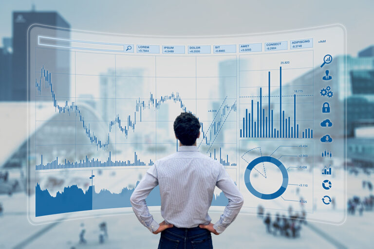 Man vor Finanz-Dashboard